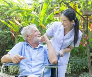 A,Nurse,Take,Care,A,Senior,Male,On,Wheelchair,In